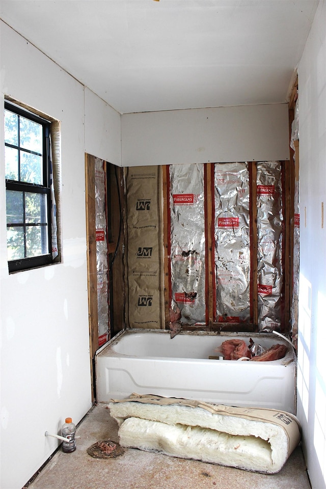 bathroom featuring a tub to relax in