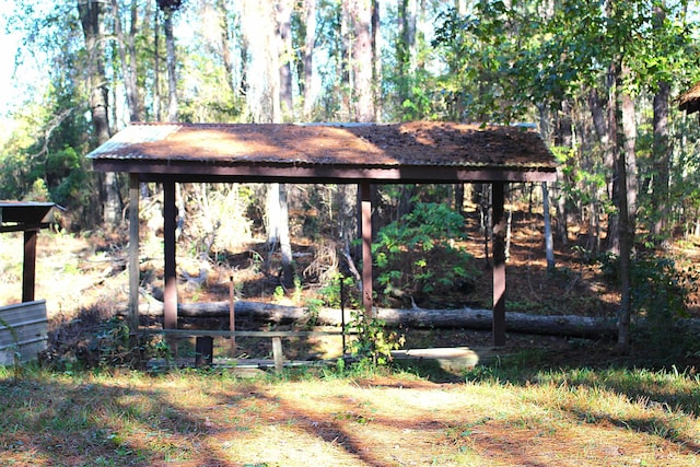 view of yard with a view of trees