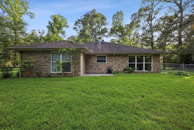 16 Briarcliff Ln, Lumberton, TX 77657 - back of property with a patio area and brick siding