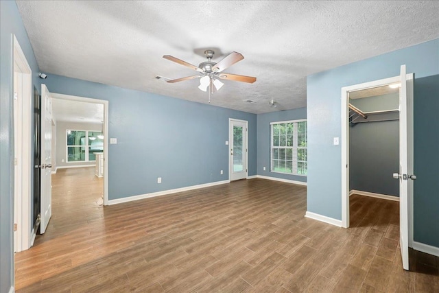 16 Briarcliff Ln, Lumberton, TX 77657 - empty room featuring a ceiling fan, a textured ceiling, and wood finished floors
