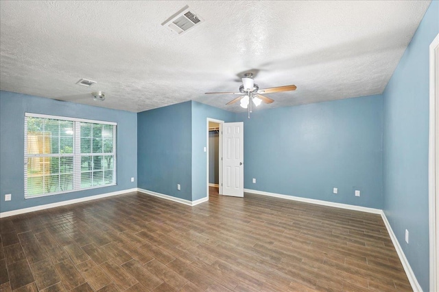 16 Briarcliff Ln, Lumberton, TX 77657 - empty room featuring a textured ceiling, a ceiling fan, and wood finished floors