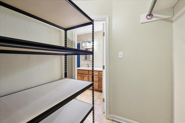 16 Briarcliff Ln, Lumberton, TX 77657 - walk in closet with light tile patterned flooring and a sink
