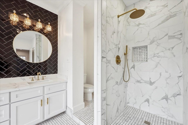 full bathroom with a marble finish shower, toilet, ornamental molding, vanity, and tile walls