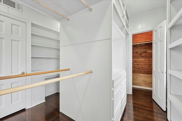 walk in closet featuring dark wood-type flooring and visible vents