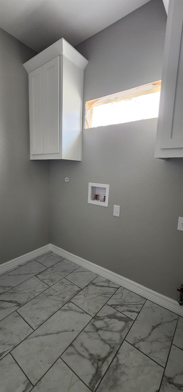 laundry room with cabinets and hookup for a washing machine