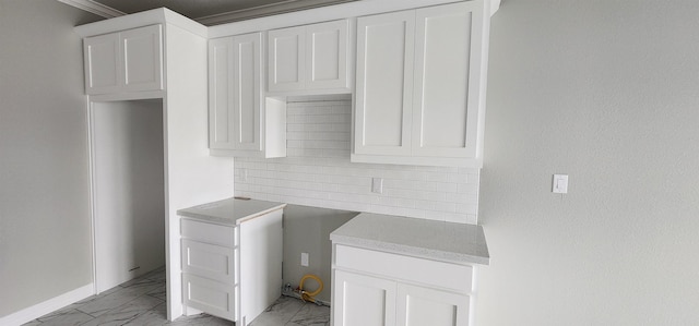 clothes washing area featuring ornamental molding