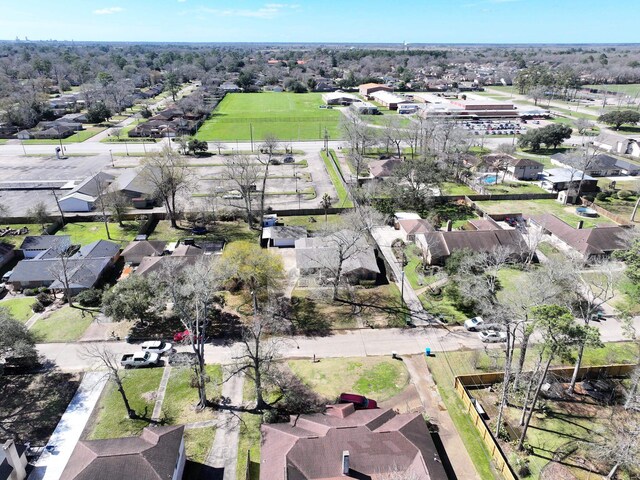 aerial view of property and surrounding area with nearby suburban area