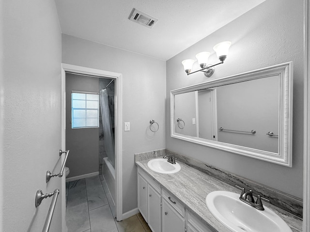 bathroom with double vanity, shower / bath combination with curtain, baseboards, and marble look tile flooring