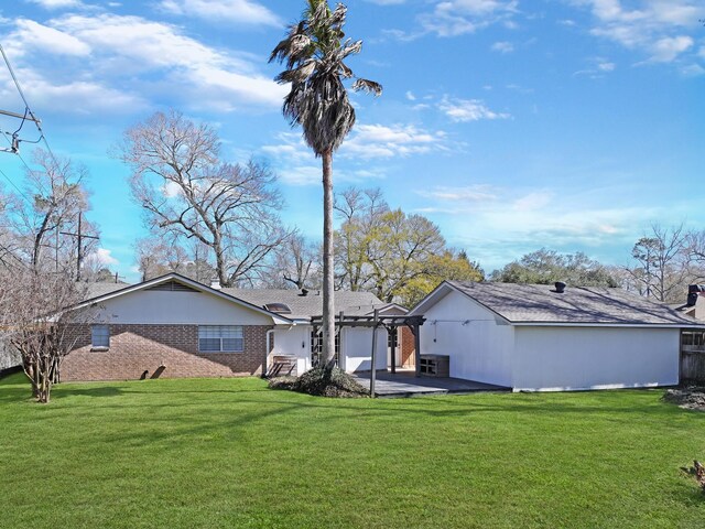 rear view of property featuring a patio area