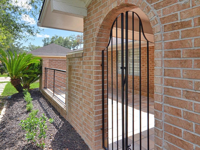 exterior view of a gate and brick siding