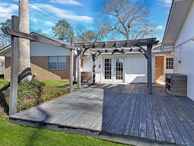 wooden deck with french doors and a pergola