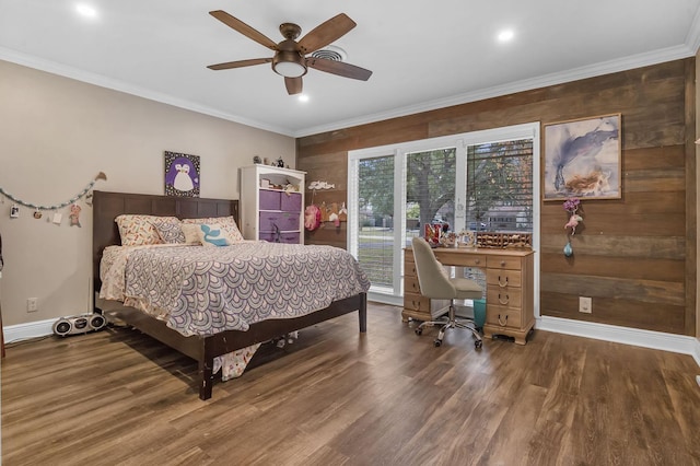 bedroom with dark hardwood / wood-style flooring, ornamental molding, and ceiling fan