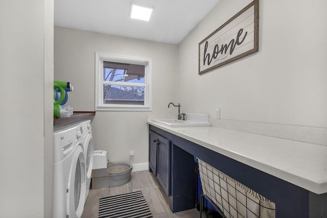 bathroom with vanity, washer and clothes dryer, and toilet