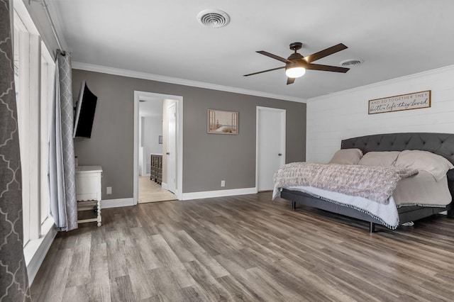 bedroom with crown molding, ceiling fan, connected bathroom, and hardwood / wood-style flooring