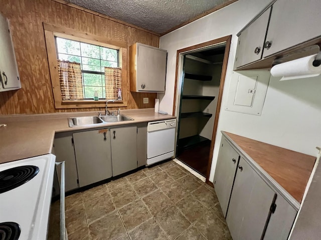 357 Hawks, Kountze, TX 77625 - kitchen featuring white dishwasher, range, a textured ceiling, light countertops, and wooden walls