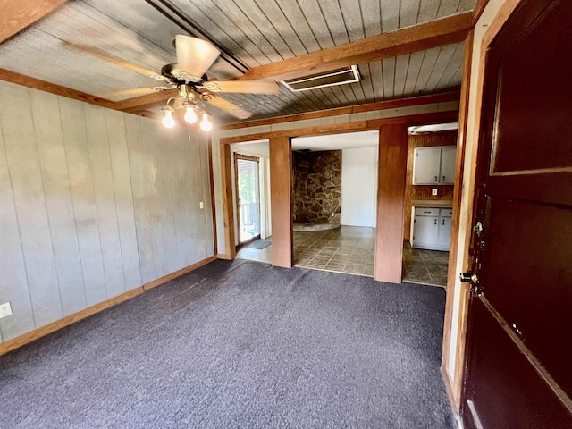 357 Hawks, Kountze, TX 77625 - unfurnished room featuring wooden walls, carpet, wooden ceiling, and a ceiling fan