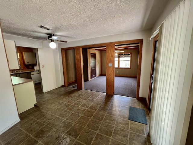 357 Hawks, Kountze, TX 77625 - unfurnished living room featuring ceiling fan and a textured ceiling