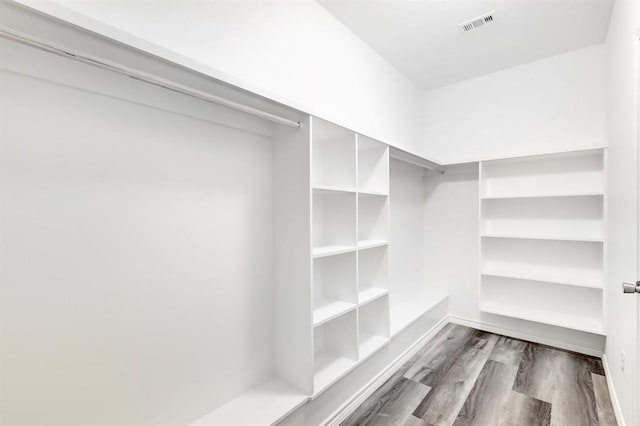 walk in closet featuring dark hardwood / wood-style flooring