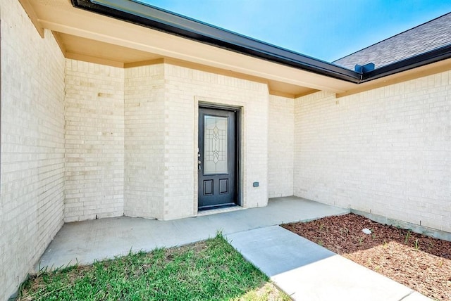 doorway to property featuring a patio area