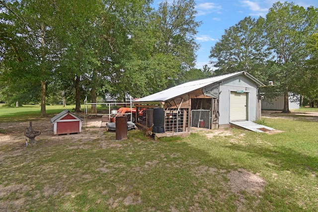 115 Pr 5250, Warren, TX 77664 - view of grassy yard with an outbuilding and a garage