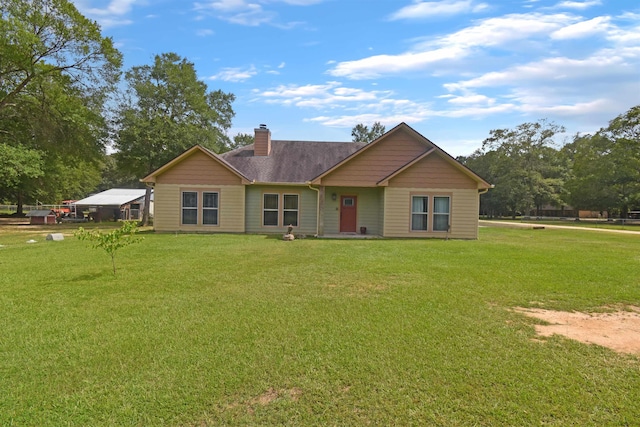 115 Pr 5250, Warren, TX 77664 - ranch-style home with a chimney, a front lawn, and roof with shingles