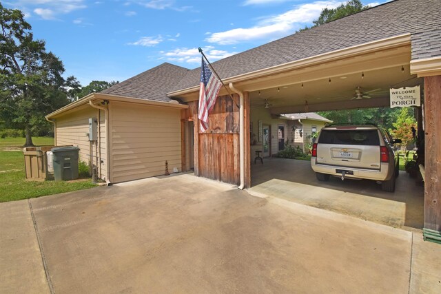 115 Pr 5250, Warren, TX 77664 - view of side of home with roof with shingles, a ceiling fan, concrete driveway, and an attached carport