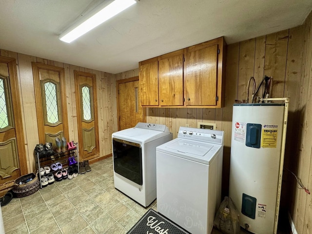 200 Hazel Dr, Village Mills, TX 77663 - laundry area featuring electric water heater, wooden walls, cabinet space, and independent washer and dryer