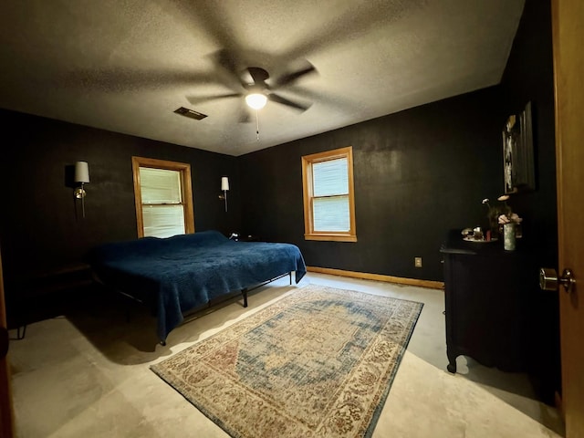 200 Hazel Dr, Village Mills, TX 77663 - bedroom with a textured ceiling, ceiling fan, and concrete floors