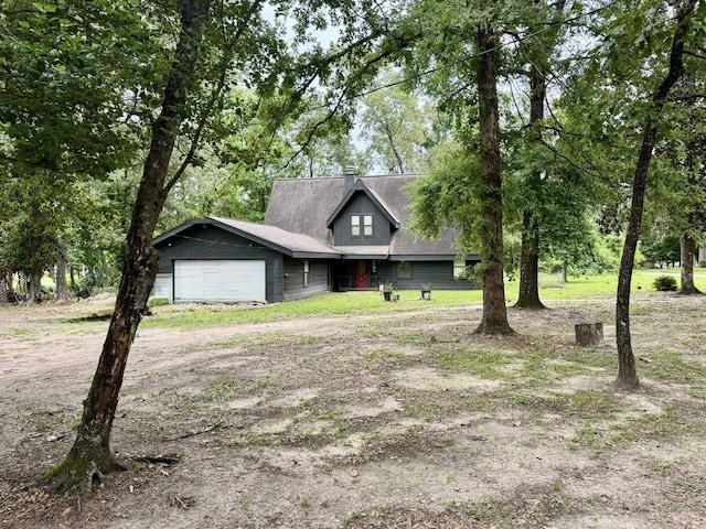 200 Hazel Dr, Village Mills, TX 77663 - view of front of home featuring a garage and driveway