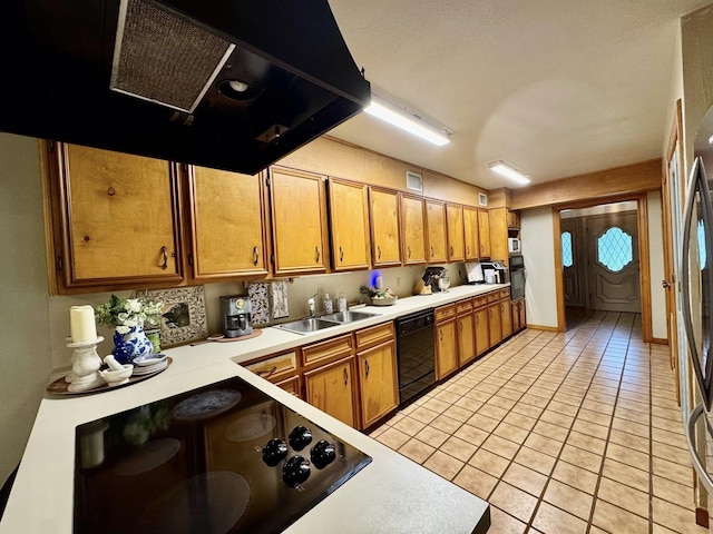 200 Hazel Dr, Village Mills, TX 77663 - kitchen featuring ventilation hood, black appliances, a sink, light countertops, and light tile patterned flooring
