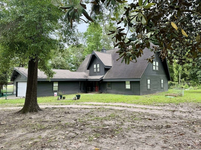 200 Hazel Dr, Village Mills, TX 77663 - view of front of property with a shingled roof and a front yard