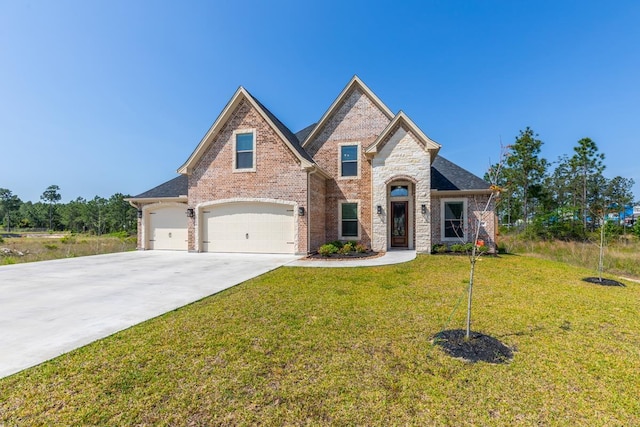 view of front of home with concrete driveway, brick siding, a front yard, and a garage