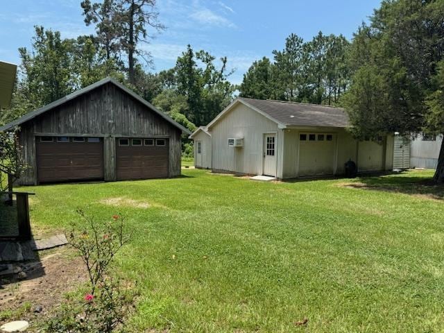 view of yard featuring an outbuilding and a garage