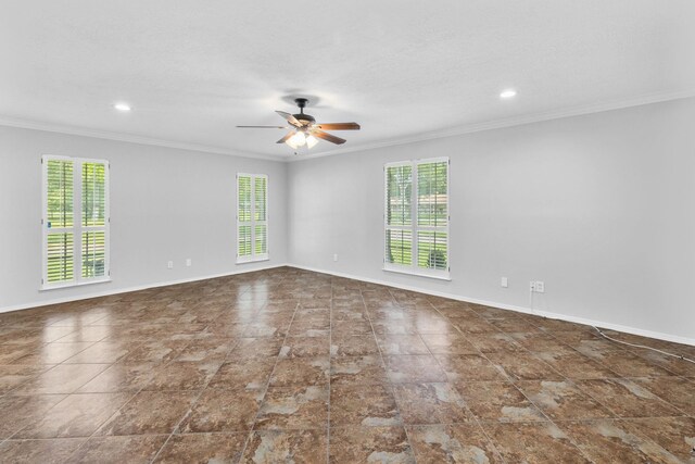 spare room with ceiling fan and crown molding