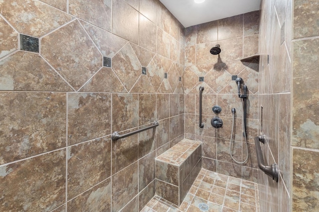 bathroom with tiled shower