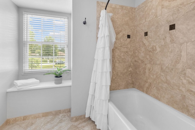 bathroom with shower / bathtub combination with curtain