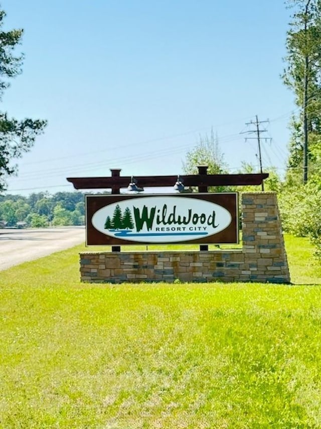 215 Wildwood Dr, Village Mills, TX 77663 - community / neighborhood sign with a lawn