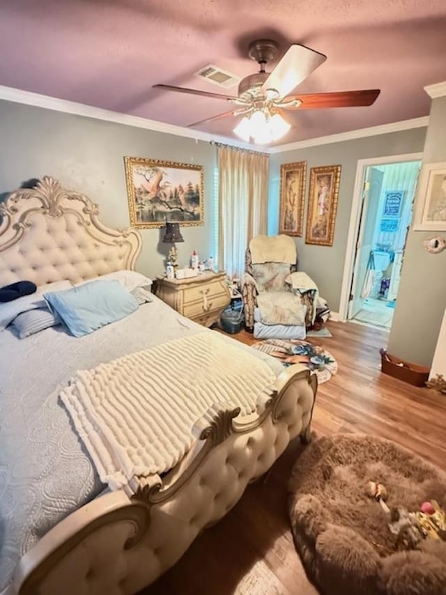 215 Wildwood Dr, Village Mills, TX 77663 - bedroom featuring crown molding, visible vents, ceiling fan, and light wood-type flooring