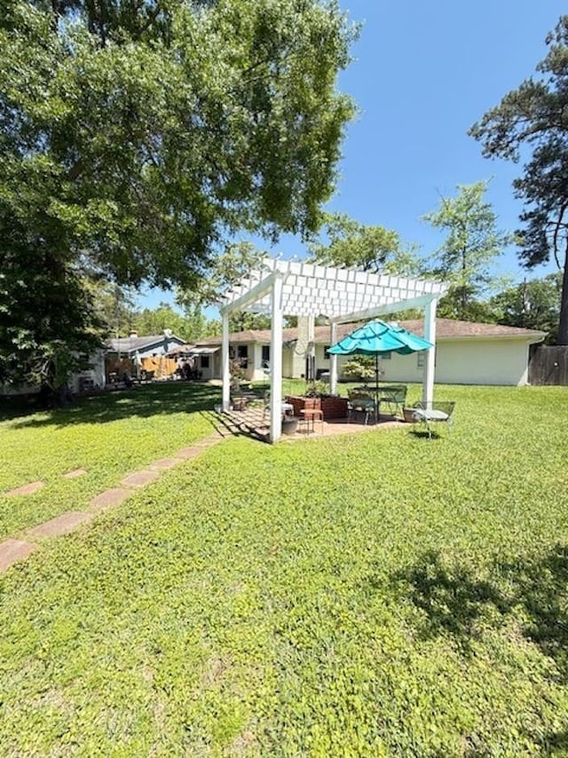 215 Wildwood Dr, Village Mills, TX 77663 - view of yard with fence, a patio, and a pergola