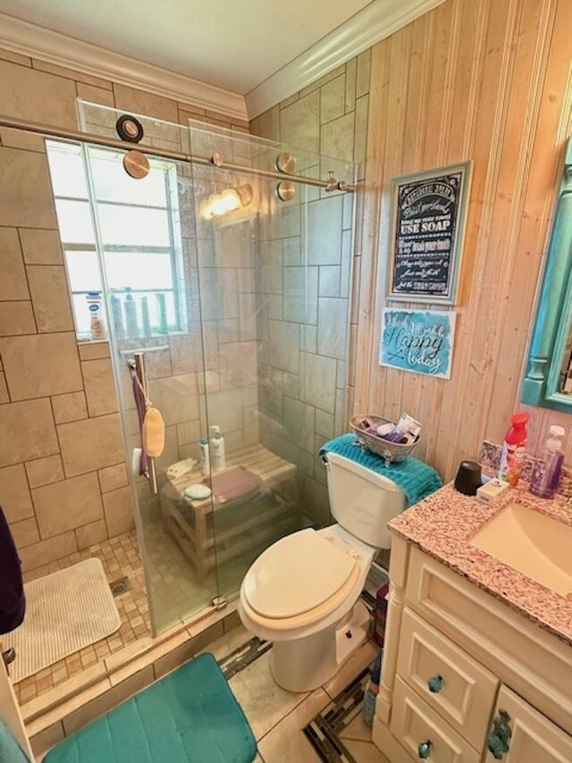 215 Wildwood Dr, Village Mills, TX 77663 - full bathroom with ornamental molding, toilet, vanity, tile patterned floors, and a stall shower