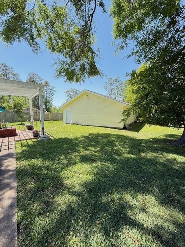 215 Wildwood Dr, Village Mills, TX 77663 - view of yard featuring a patio, a pergola, and fence