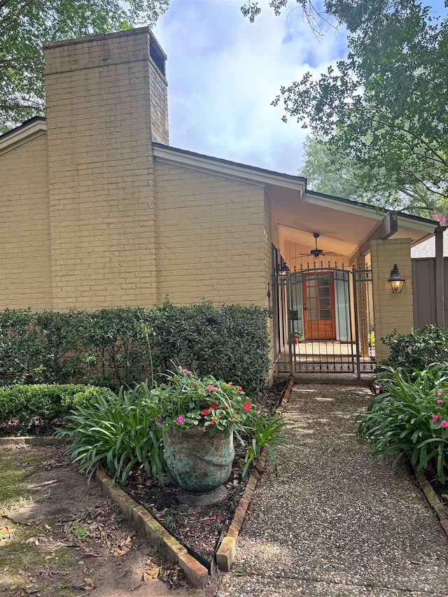 4370 Thomas Ln, Beaumont, TX 77706 - entrance to property with a chimney and brick siding