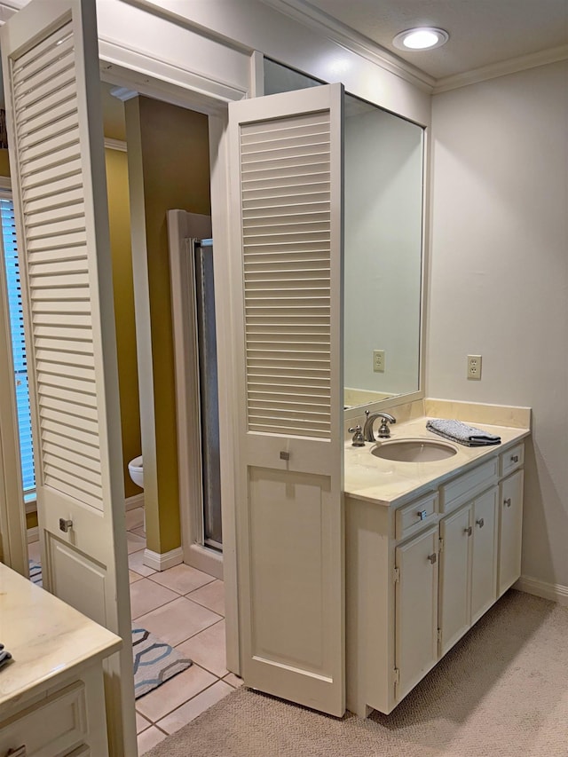 4370 Thomas Ln, Beaumont, TX 77706 - bathroom featuring vanity, crown molding, a stall shower, tile patterned floors, and recessed lighting