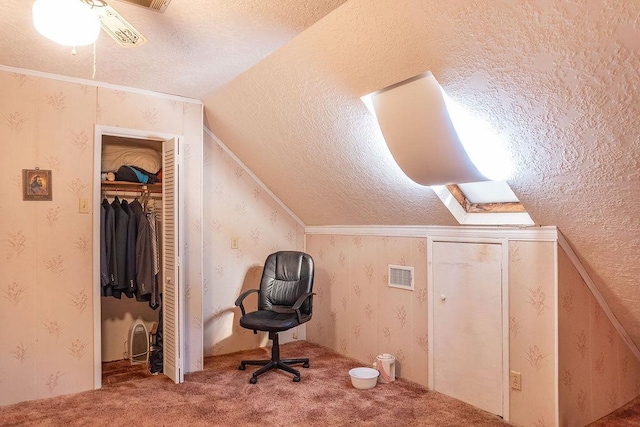 bonus room with carpet, a textured ceiling, vaulted ceiling, and ceiling fan