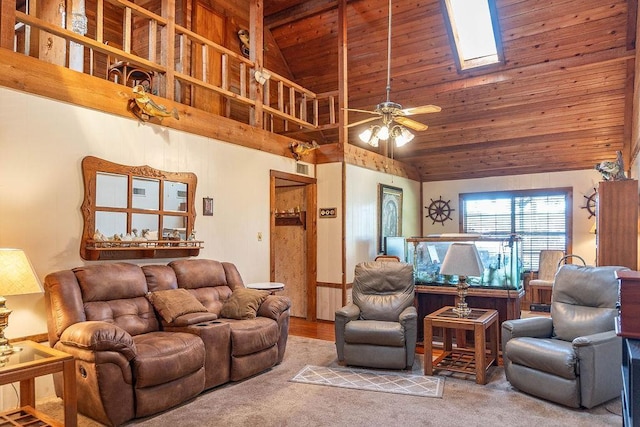 living room with carpet, wooden ceiling, high vaulted ceiling, a skylight, and ceiling fan