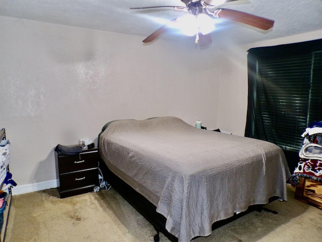 6162 E Dr, Groves, TX 77619 - bedroom with carpet and a ceiling fan