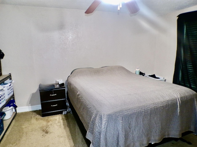6162 E Dr, Groves, TX 77619 - carpeted bedroom with a ceiling fan and baseboards