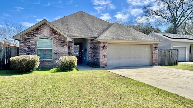 single story home with brick siding, roof with shingles, an attached garage, driveway, and a front lawn