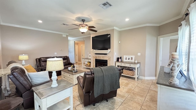 living room featuring a fireplace, visible vents, a ceiling fan, and light tile patterned flooring