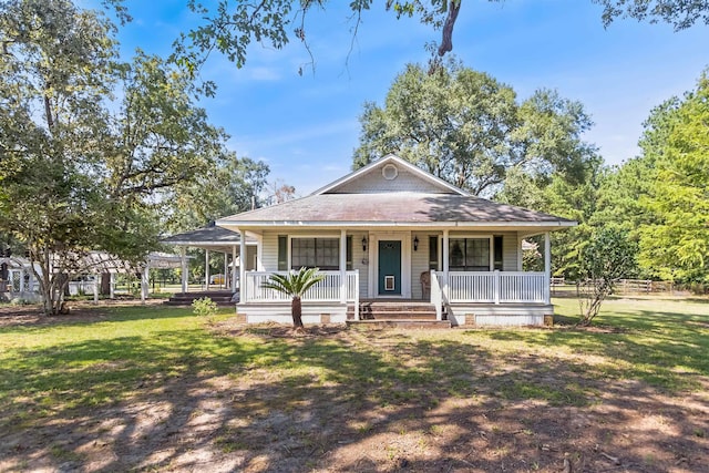 view of front of house featuring a front yard and covered porch